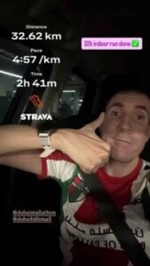 Strava fitness tracking screenshot with a smiling man inside a car, showing 32.62 km run distance.