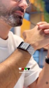 Stylish black and white patterned smart watch on man's wrist for fitness and fashion.