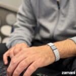 Silver woven mesh bracelet on man's wrist, casual look, stylish accessories, trendy men's jewelry.