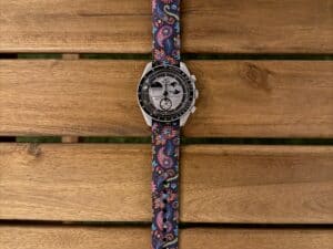 Omega x Swatch MoonSwatch with zamani Paisley heritage band on wood