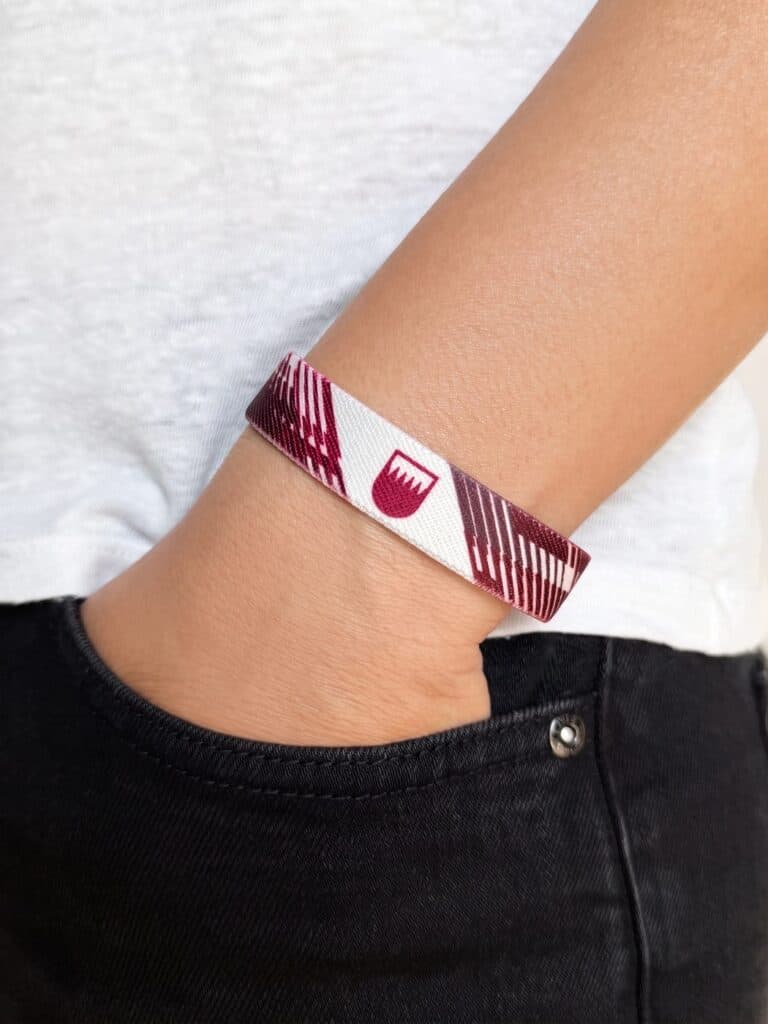 Qatar Khaleeji 27 wristband worn on the wrist, flag side
