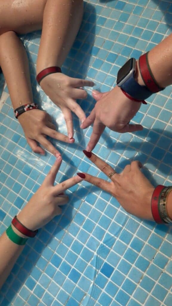 Friends wearing The Beautiful Game wristbands