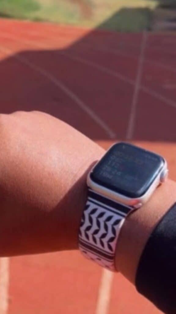 Customer wearing the Keffiyeh Apple Watch band on a running track
