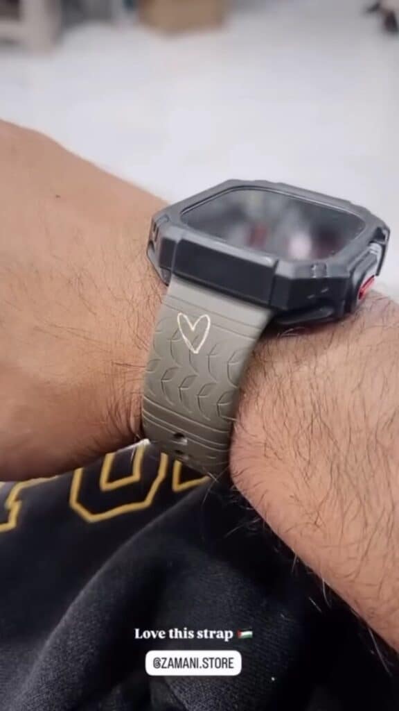 Customer wearing the Olive Keffiyeh engraved Apple Watch band