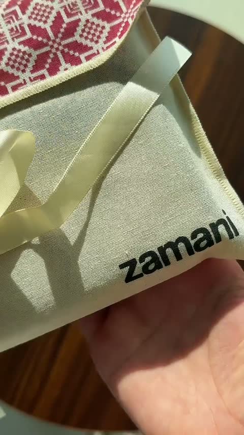 Unboxing a zamani gift: the tatreez gift bag, its ribbon, the card, the box and the band